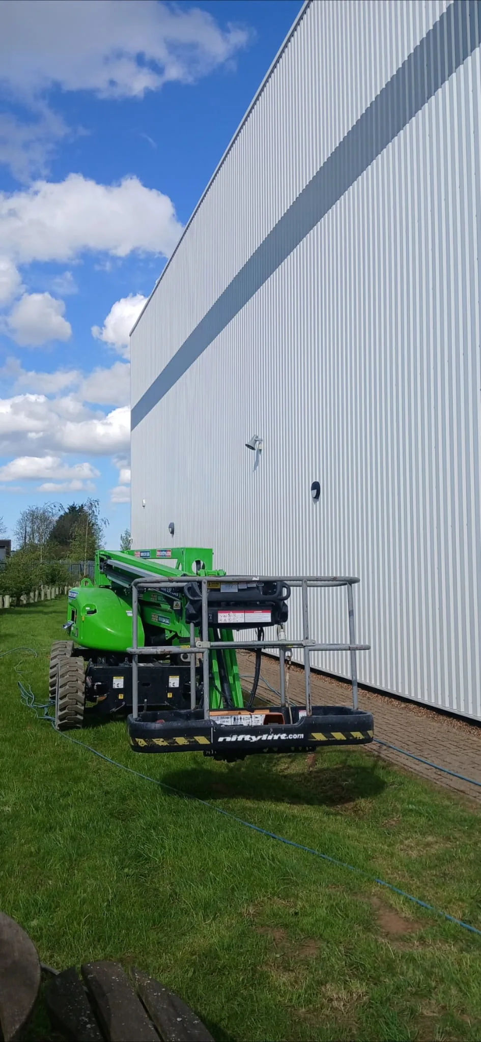 MEWP access for warehouse cladding cleaning - Partridges, Desborough