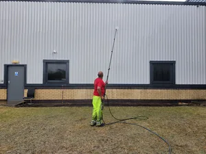 During - commercial building metal cladding water fed pole wash, Rugby.