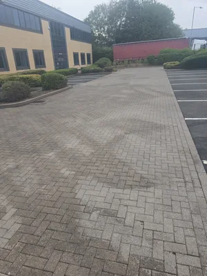commercial car park block paving heavy algae weathering