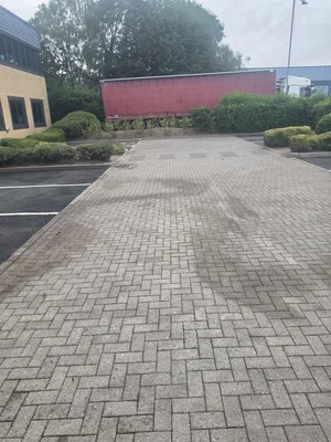 After - commercial car park herringbone block paving algae pressure washed, Rugby.