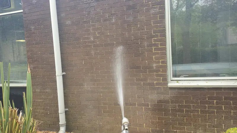 Soft wash solution flowing down brick elevation, Northampton.