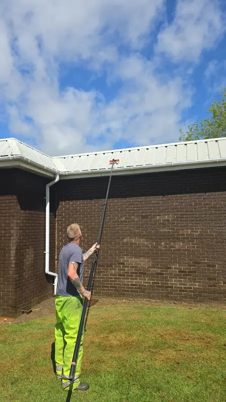 Water fed pole cleaning gable cladding, Northampton.