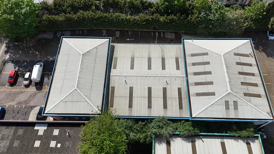 Before - commercial buildings corrugated metal roofs aerial algae lichen survey, Northampton.
