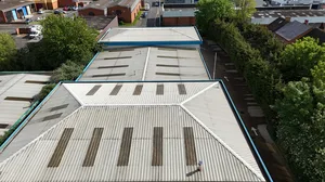Before - commercial corrugated metal roof algae lichen growth aerial survey, Northampton.