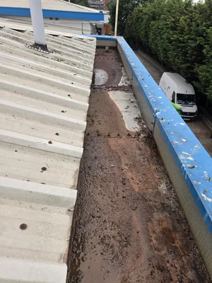 commercial building steel box gutter severe rust corrosion damage