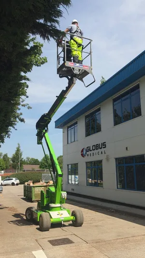During - commercial office MEWP access gutter clearing cherry picker, Northampton.