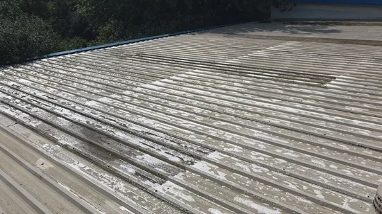 Before - commercial corrugated metal roof lichen algae coating deterioration, Northampton.