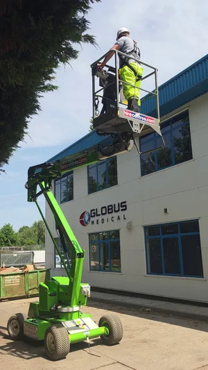 During - commercial office building mewp access roof softwash biocide treatment, Northampton.