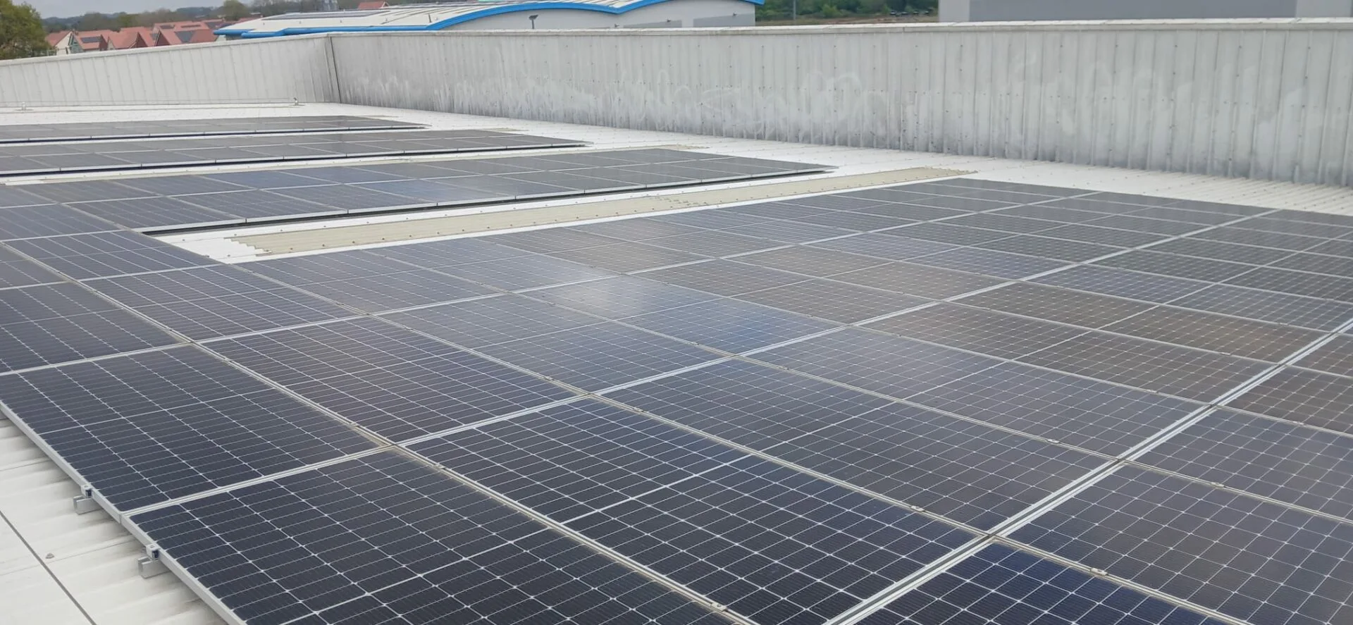 Solar panel array on Partridges warehouse roof after cleaning, Desborough
