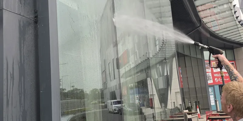 Before - commercial venue large glazing facade atmospheric grime aluminium frames, Birmingham.
