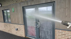 During - commercial school building glazed doors timber cladding water fed pole rinse, West-Bromwich.