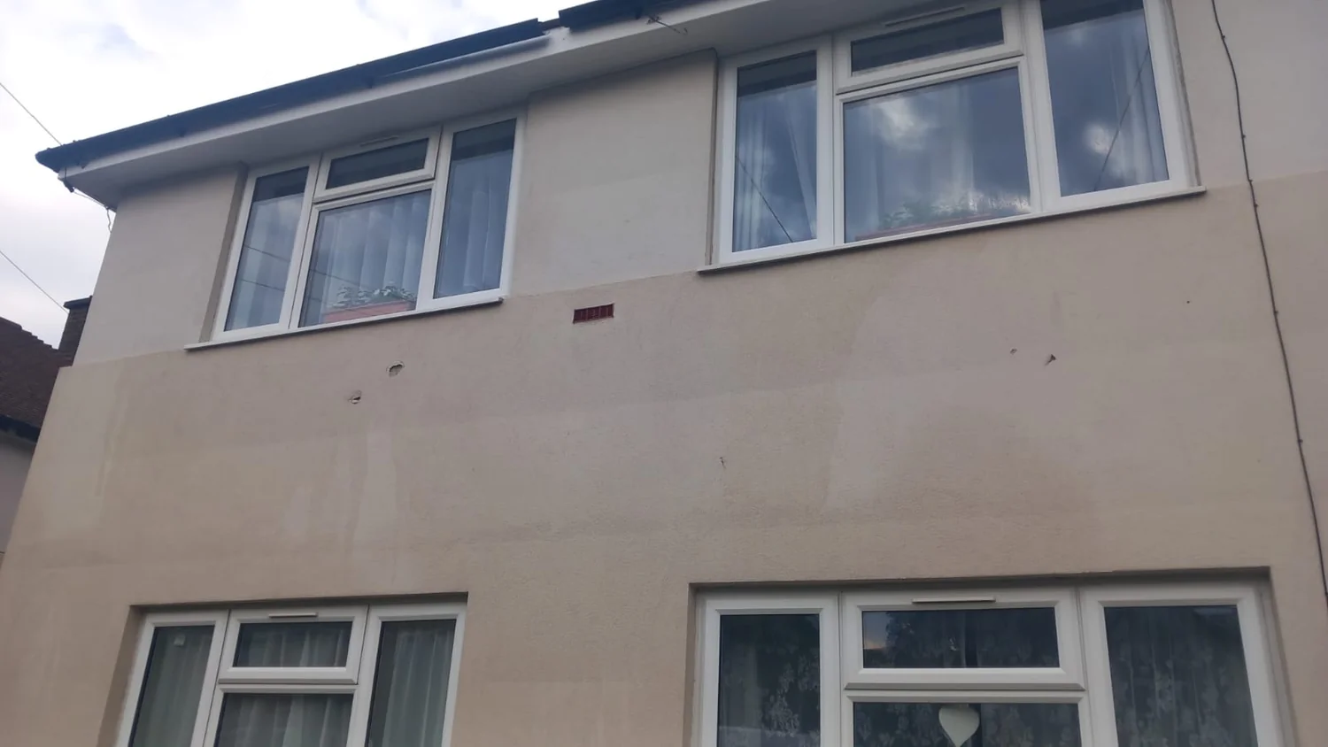 Council housing render after soft washing - K-Rend restored to original colour in Northampton