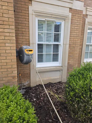 During - residential red brick facade pressure wash equipment setup, Orlingbury.