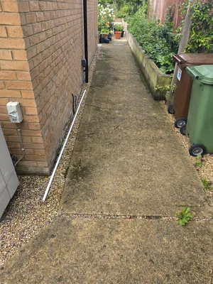 Before - concrete path with green algae and weeds in the joints, Orlingbury.