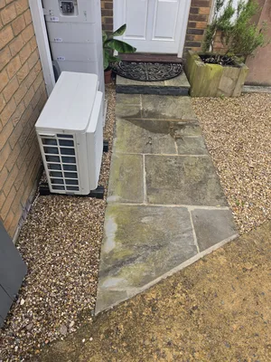 Before - residential natural stone patio flagging algae moss staining, Orlingbury.