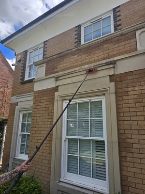 buff brick residential facade water fed pole window cleaning