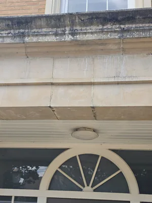 Before - heritage building natural stone pillar black algae biological staining, Orlingbury.