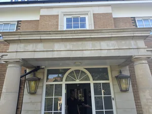 residential stone portico columns algae staining biological growth