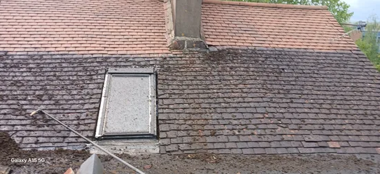 During - residential multi pitch slate clay tile roof moss scrape mid clean, North West London.
