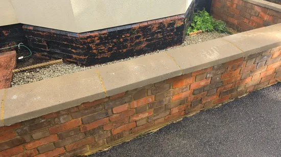 Before - residential red brick boundary wall lichen algae stained coping, Northampton.