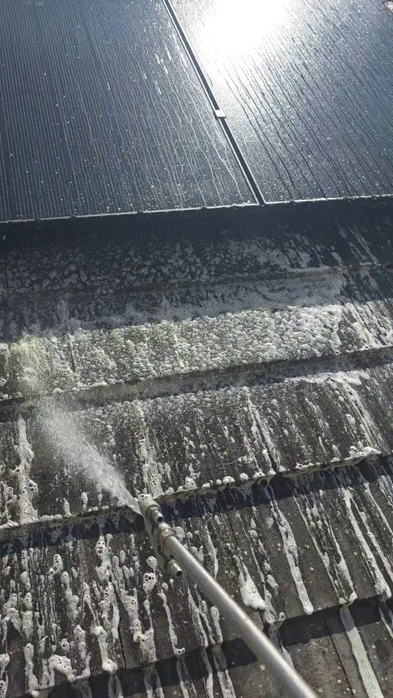Before - residential concrete roof tiles heavy lichen algae solar panels, Northampton.