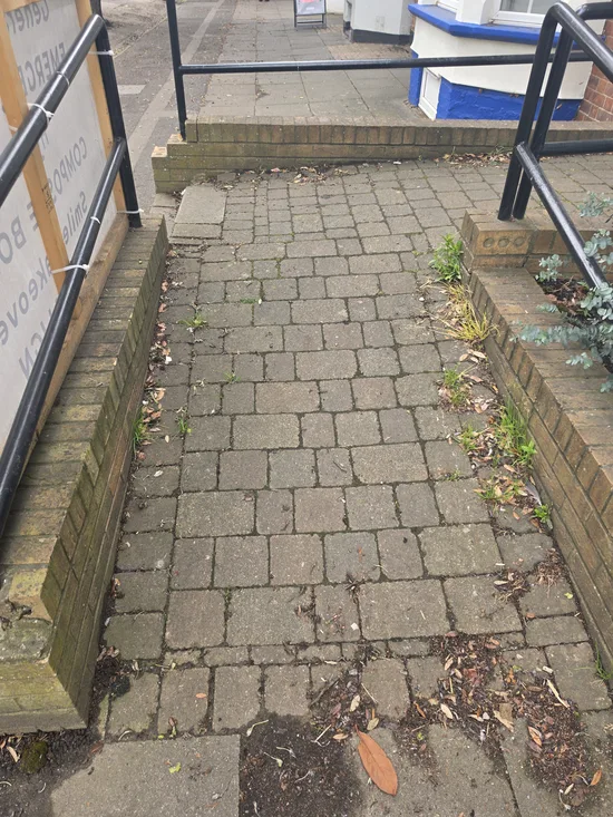 Before - commercial surgery entrance block paving moss weed biological growth, Northampton.