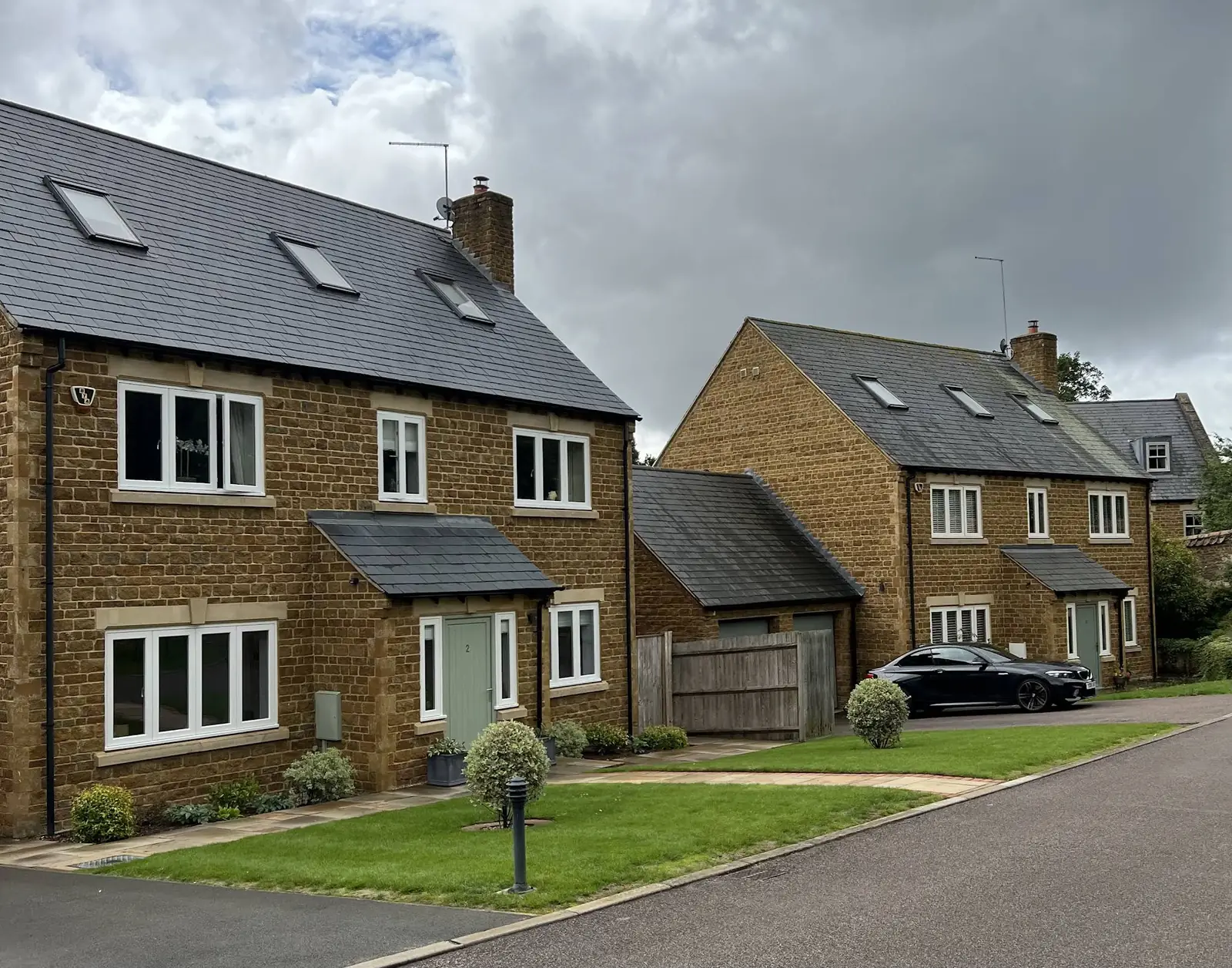 Roof half-cleaned after 8 months of DDAC treatment - clean side compared to mossy side